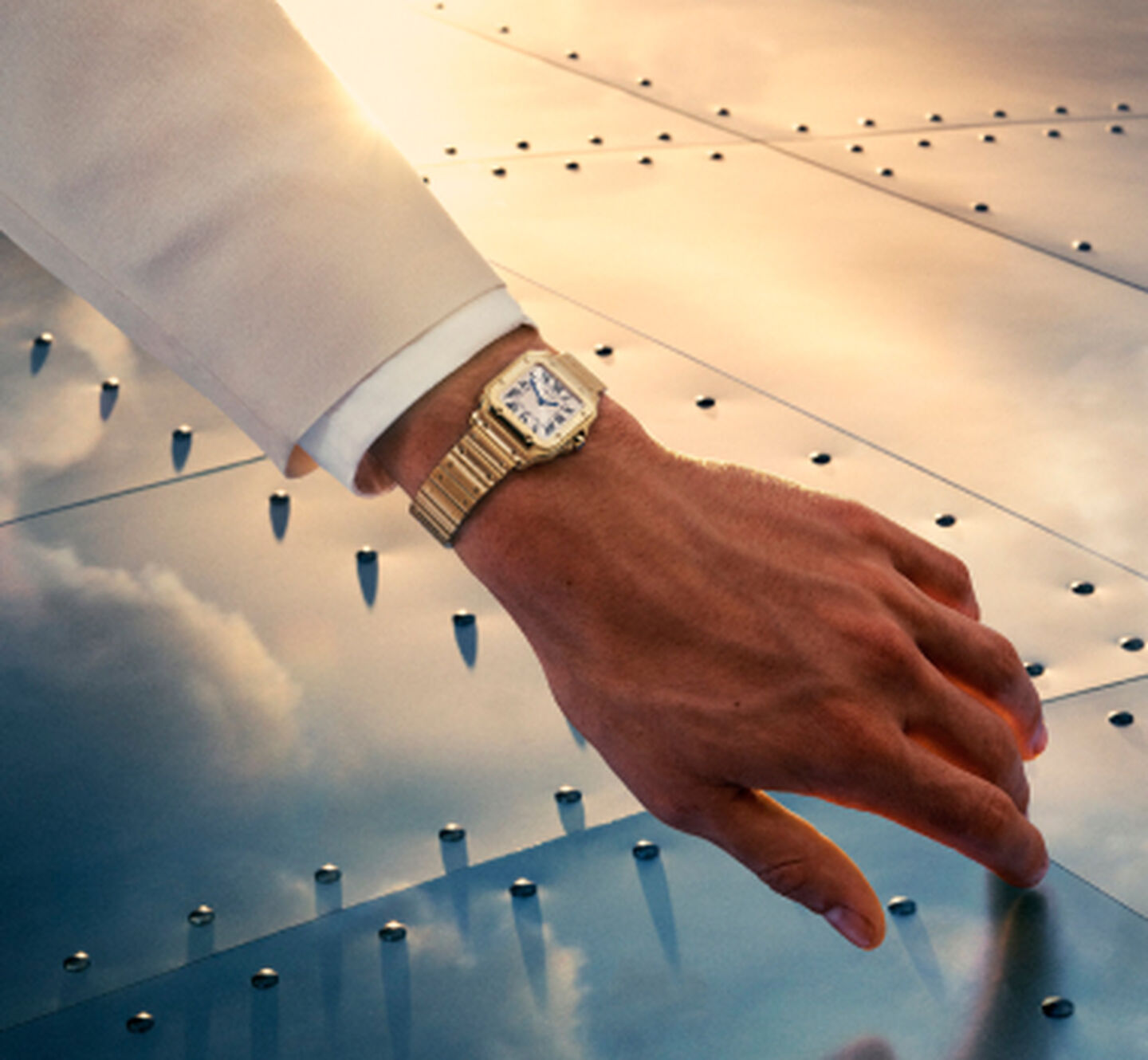 A man wearing a Santos de Cartier watch.